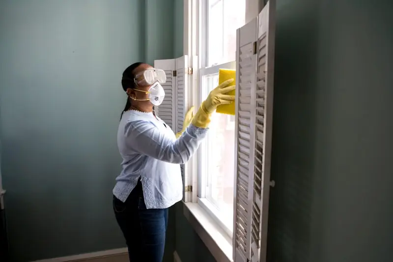 Professional cleaner wiping a kitchen counter