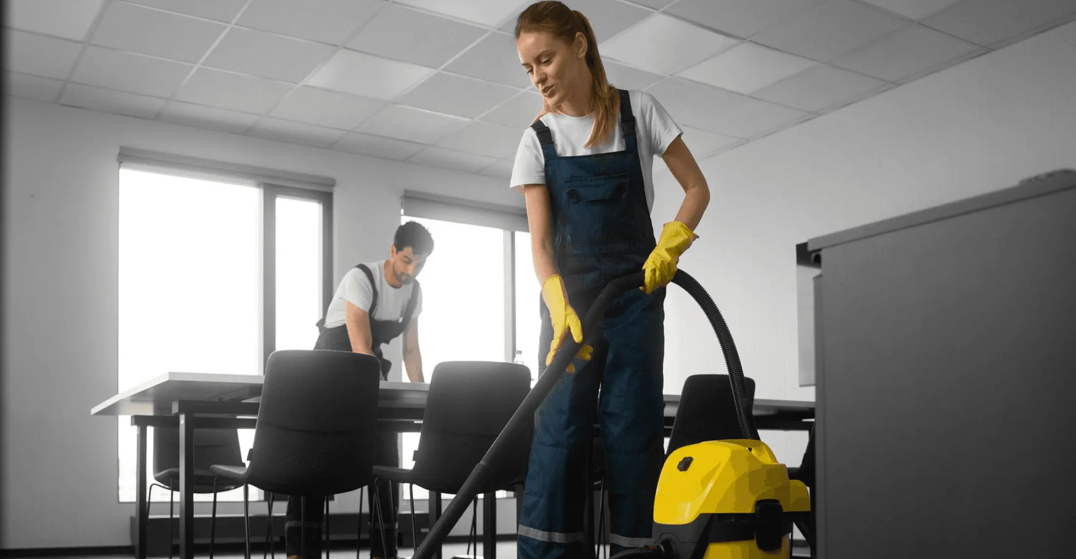 Cleaning professional vacuuming an office